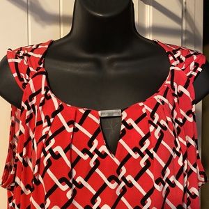 Coral, black and white geometric print sleeveless blouse w/ silver metal detail